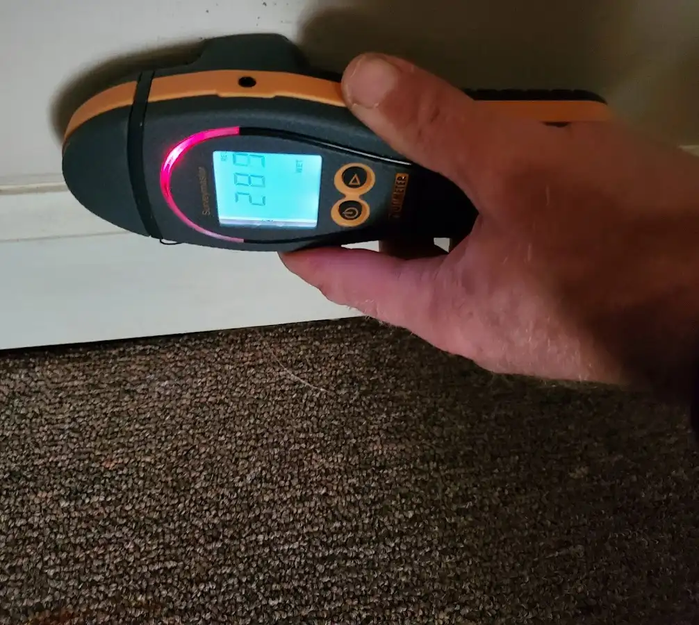 Moisture detection at baseboard during Storm Damage Restoration in Selma